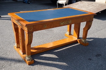 An Empire style gilt metal mounted bird's eye maple bureau plat fitted three drawers, width 160cm, depth 89cm, height 77cm